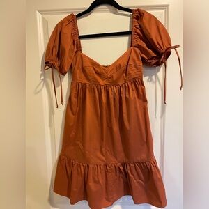 Boutique Baby Doll Dress in Burnt Orange color